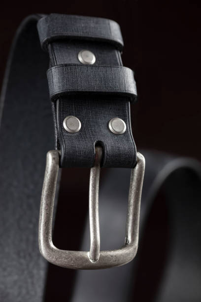 istock Black leather belt on a dark background. Leather products. 1431353457