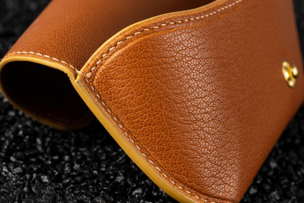 istock Part of a brown leather wallet or case with stitching. 1431353458