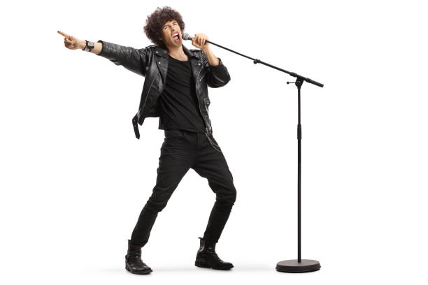 istock Male singer in a leather jacket singing loud on a microphone 1431357806