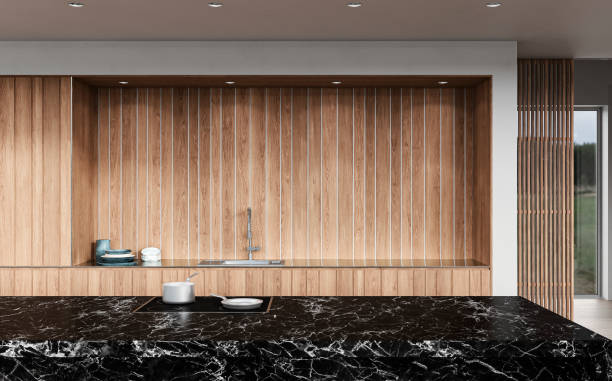 istock A close up of a modern white kitchen with rectangular black marble breakfast kitchen island 1431360822