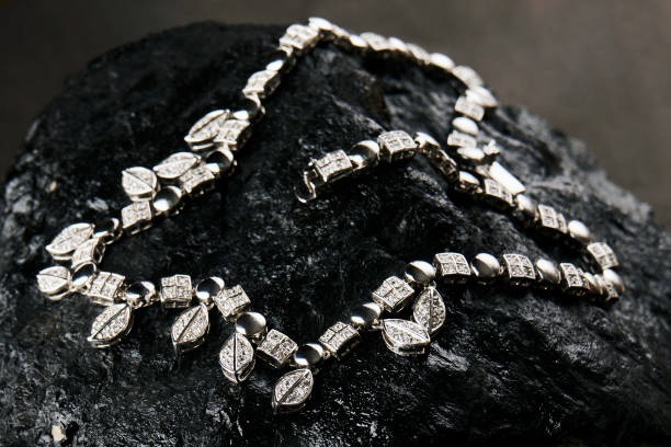 istock Platinum necklace with diamonds on black background with copy space 1431364115