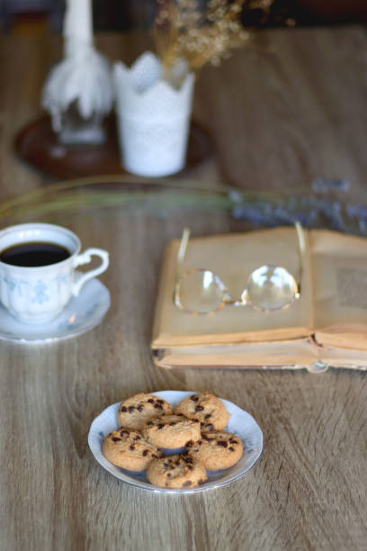 istock Tea, Cookies, Book, Candles and Lavender 1431365329