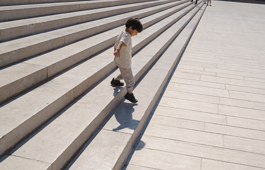 Cute little boy playing on stairs at Anitkabir, Ankara,Turkiye