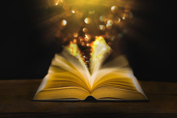 istock open bible on wooden table with vintage 1431370818