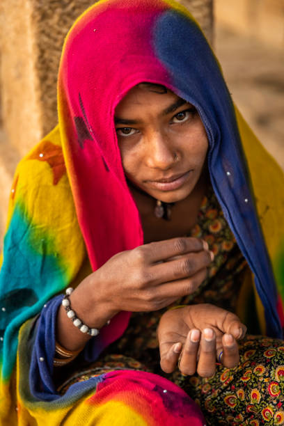 istock Poor Indian girl asking for help 1431381857