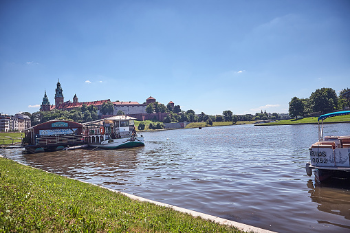 Krakow, Poland - July 03, 2015 : View of Vistula river with Wawel Castle at the background