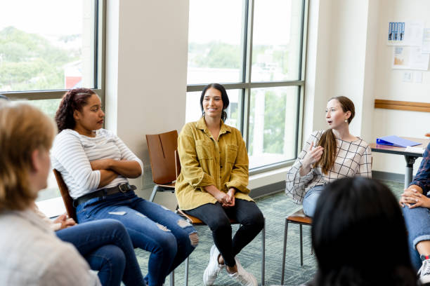 istock Young adults share feelings in group therapy 1431383886