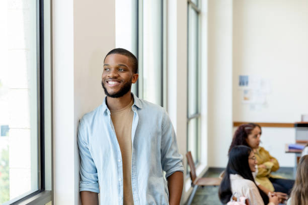 istock Casually dressed male teacher takes break from class 1431383904