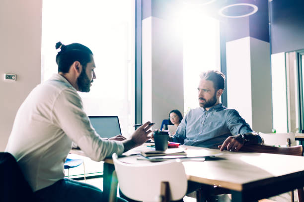istock Business people in open office talking 1431384066