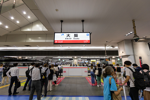 Osaka, Japan - August 17, 2022 : Passengers at JR Osaka Station in Osaka, Japan. It is a major railway station in the Umeda of Kita-ku, Osaka, Japan.