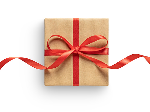 Gift box with red ribbon on white. This file is cleaned, retouched and contains clipping path.
