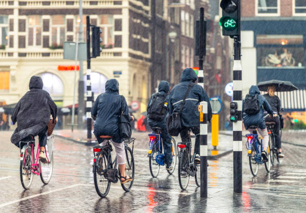 Cyclists in the rain in Amsterdam stock photo