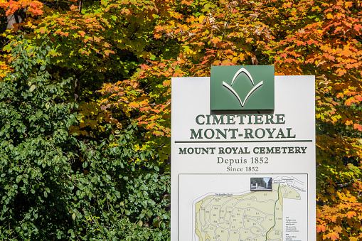 Montreal, Canada - 2 October 2022: Montreal Cemetery entrance sign and map in Autumn
