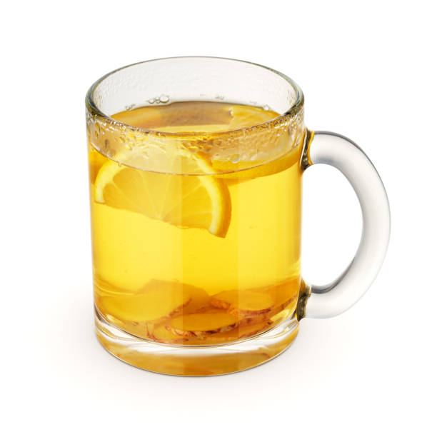 istock Hot tea with lemon and ginger in a glass mug isolated on white. 1431412612