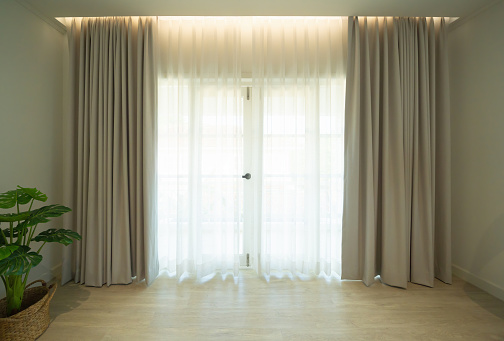 Curtain fabric with empty space in living room with door and window at home or house. Interior material for design decoration background
