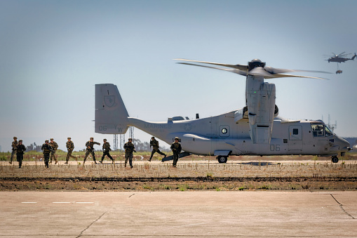 Miramar, California, USA - September 22, 2022: US Marines disembark a V-22 Osprey as part of the Marine Air Ground Task Force (MAGTF) demonstration at the 2022 Miramar Airshow.