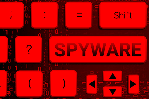 Spyware button on key board and code numbers. concept for online hacking and cyber crime.