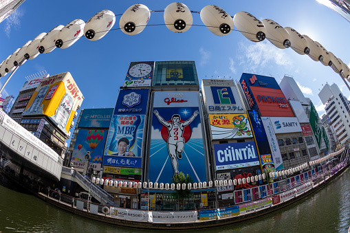 Osaka, Japan - August 19, 2022 : The billboards on the Dotonbori Canal in Osaka, Japan. Dotonbori is often selected as a scene in the Japanese movies as the symbol of Osaka.