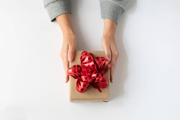 istock woman receiving an anniversary present 1431428725