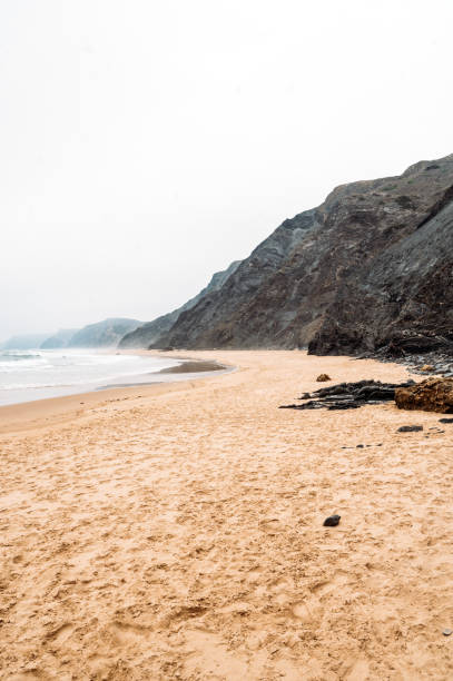 istock Rocky cliff near rippling sea 1431429196
