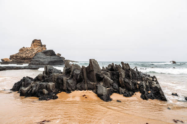 istock Rocky formations near wavy sea 1431429205
