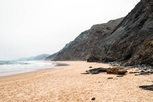 istock Rocky cliff near rippling sea 1431429215