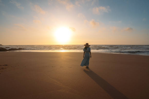 istock Anonymous woman admiring sea on sandy beach 1431429816