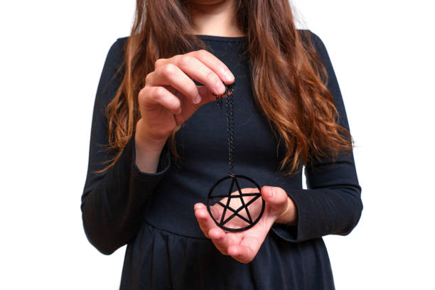 istock Lady in black showing a large pentagram necklace 1431431053