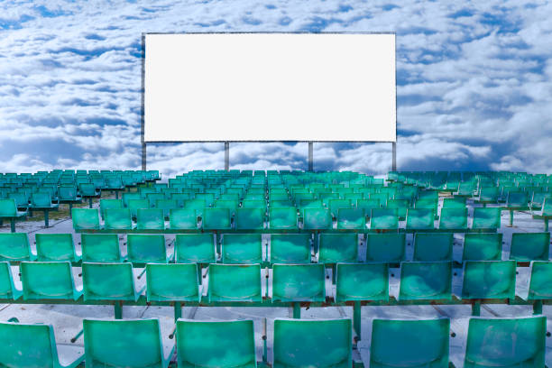 istock Outdoor cinema with chairs and white projection screen on cloudy sky background - concept image 1431431129