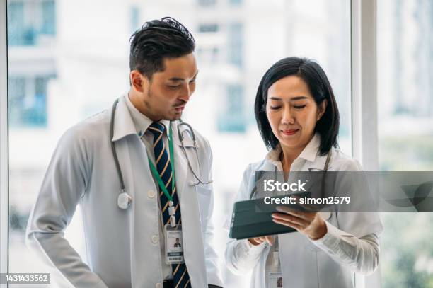 We Should Research More About This Infection Stock Photo - Download Image Now - Doctor, Digital Tablet, Office