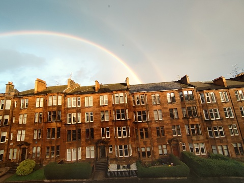 Rainbow over Historical tennemant houses at street of glasgow scotland england uk