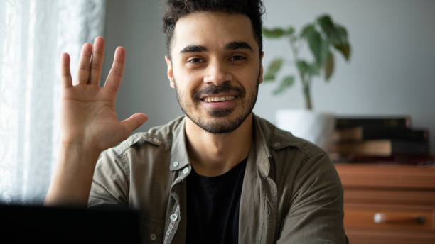 istock Head shot smiling man chatting online 1431440152