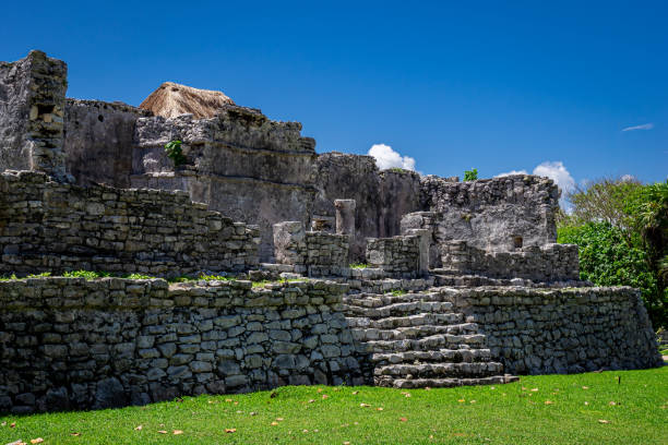 istock Tulum ruins Mayan site with temple ruins pyramids and artifacts in the tropical natural jungle forest palm and seascape panorama view in Tulum Mexico. 1431440363