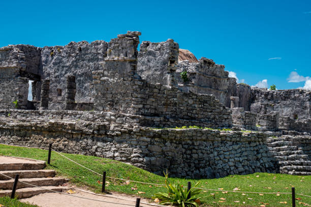 istock Tulum ruins Mayan site with temple ruins pyramids and artifacts in the tropical natural jungle forest palm and seascape panorama view in Tulum Mexico. 1431440521