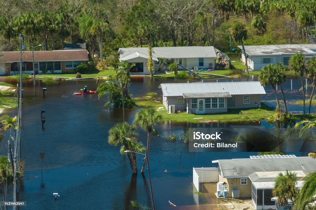 Surrounded by hurricane Ian rainfall flood waters homes in Florida residential area. Consequences of natural disaster Surrounded by hurricane Ian rainfall flood waters homes in Florida residential area. Consequences of natural disaster. Hurricane Ian Stock Photo