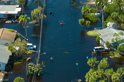 Surrounded by hurricane Ian rainfall flood waters homes in Florida residential area. Consequences of natural disaster.