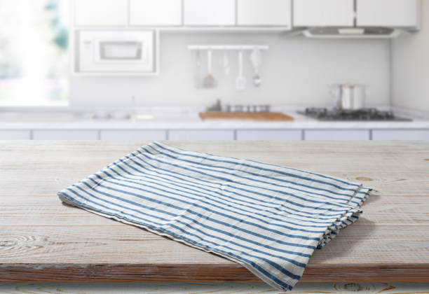 istock Napkin on wooden desk top view. Kitchen background. 1431442635