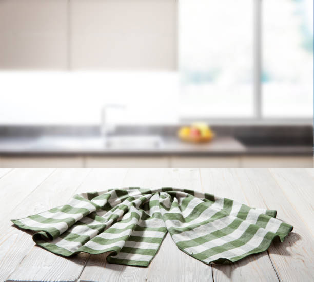 istock Table cloth on wooden deck table with napkin. Kitchen background. 1431445068