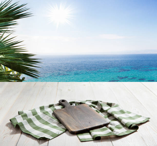 istock Table cloth on wooden deck table with napkin. Kitchen background. 1431445071