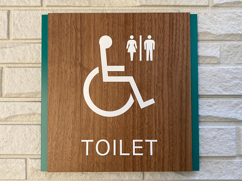 Information board for toilets for people in wheelchairs.