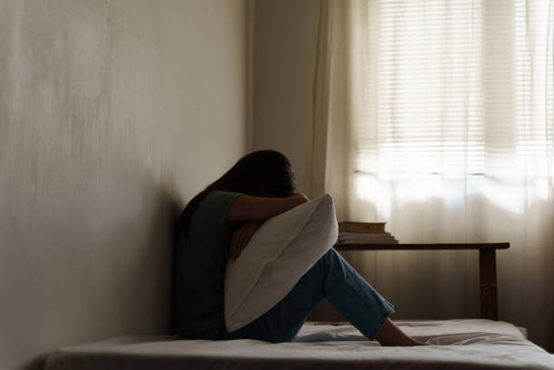 istock Depressed young woman looking thoughtful about troubles. 1431448875
