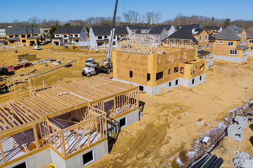 Aerial view of construction site on new modern cottages in the suburbs residential development