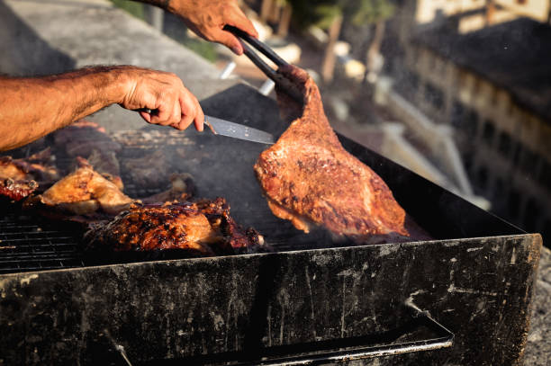 istock Close up hands chef cooking Street BBQ. Chef at work 1431449495
