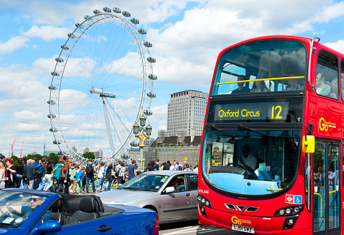 London, England - May 30: London Eye and double-decker bus in the city center on May 30, 2015 in London
