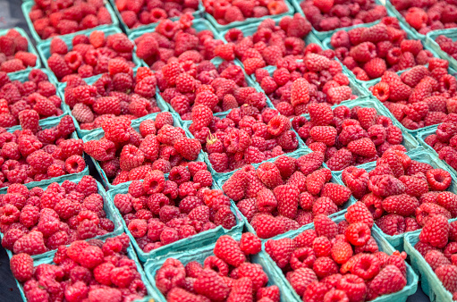 Full Frame of cartons of farmer's market raspberries