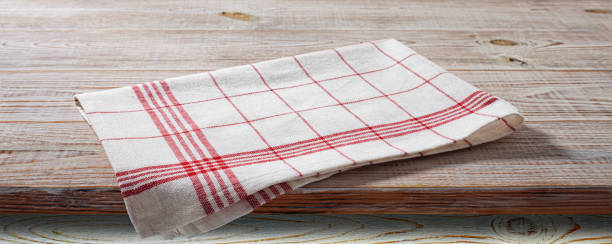 istock White napkin, table cloth on wooden deck mockup. 1431455609