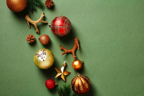 istock Vintage Christmas flat lay composition. Xmas decorations, balls, fir branches on dark green background. 1431466413