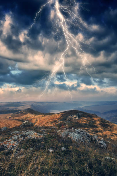 istock lightning over a hilly field. landscape with dramatic thunderclouds in the background. nature of Ukraine 1431466423