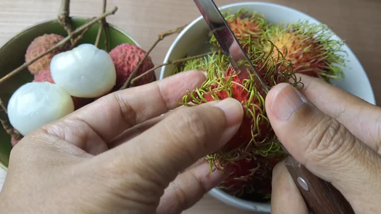 Peeling Fresh Ripe Rambutan