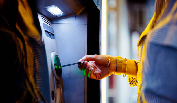 istock Close Up Photo Of Woman Hands Using ATM Machine 1431478219